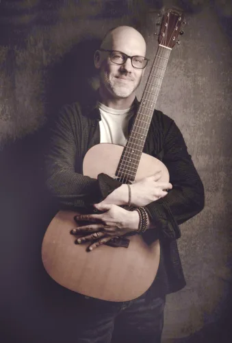 Bay College presents premier fingerstyle guitarist Woolman